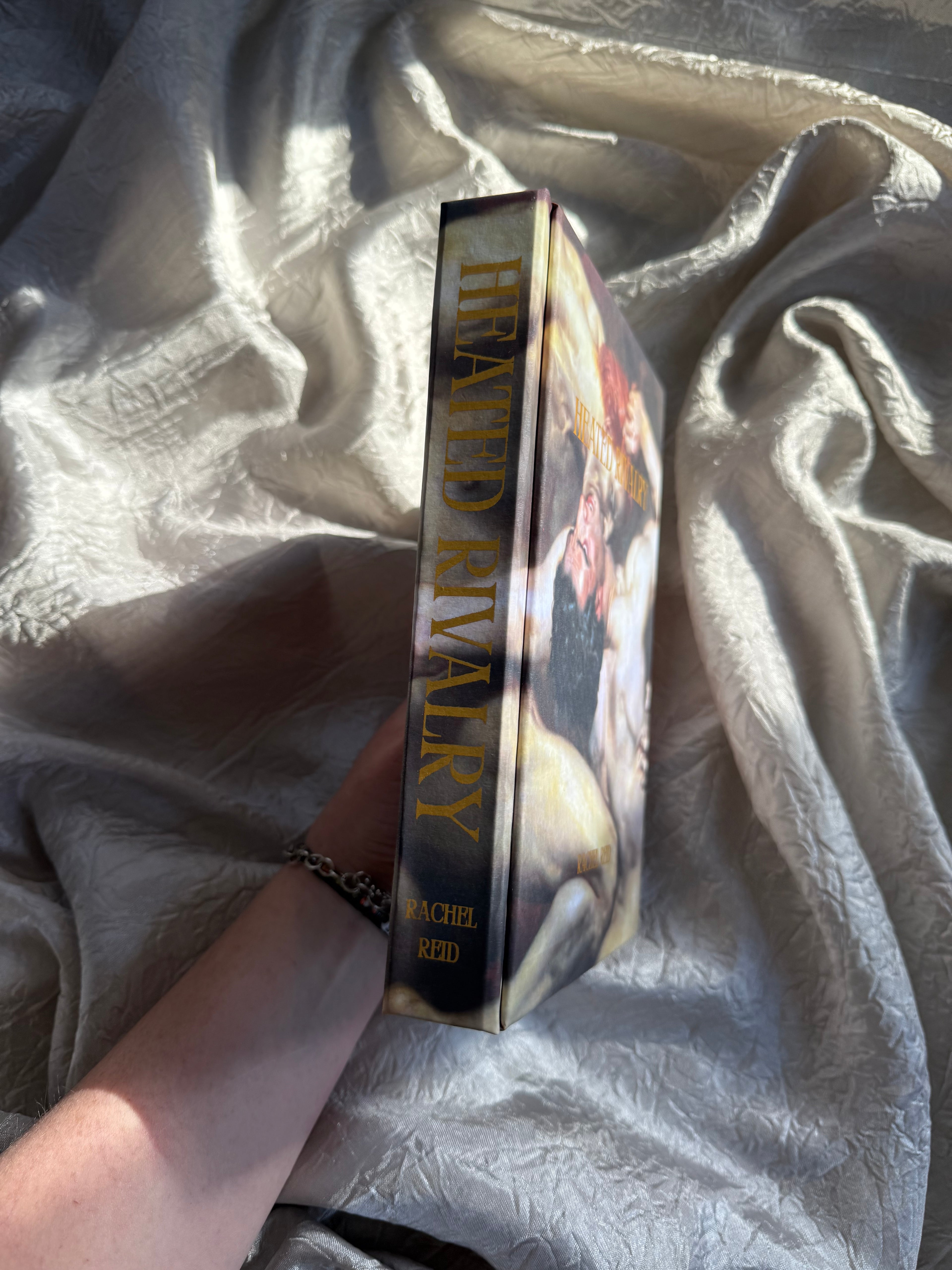 HEATED RIVALRY BY RACHEL REID